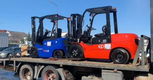 Forklifts loaded for transport